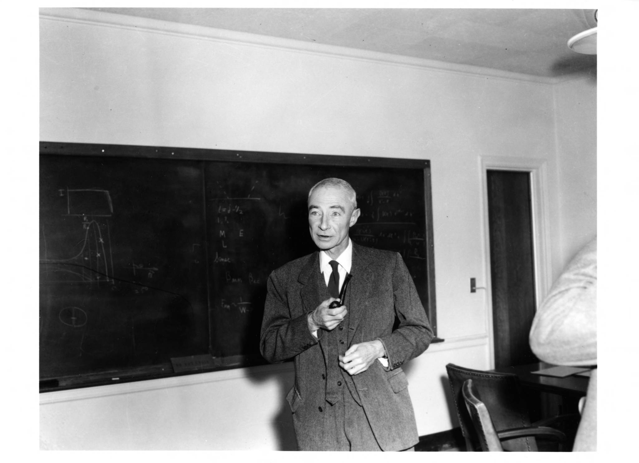 J. Robert Oppenheimer at blackboard